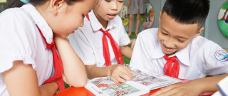 Children in primary education reading together