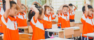 Children in Vietnamese school playing, learning through play