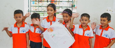 Children in Vietnamese school posing for a picture