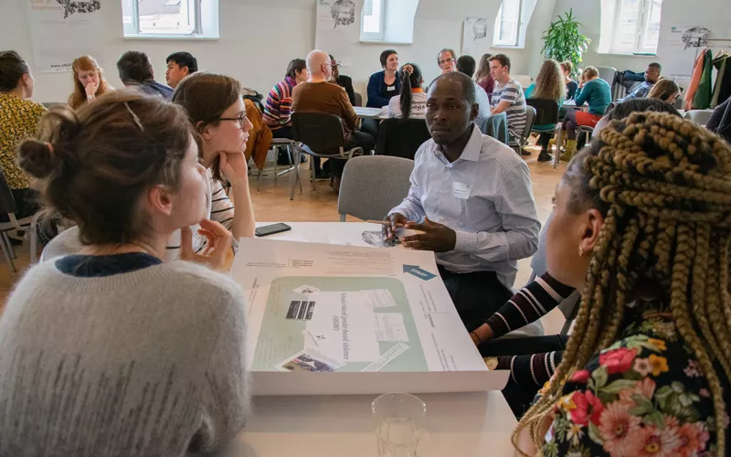 People debating at a table