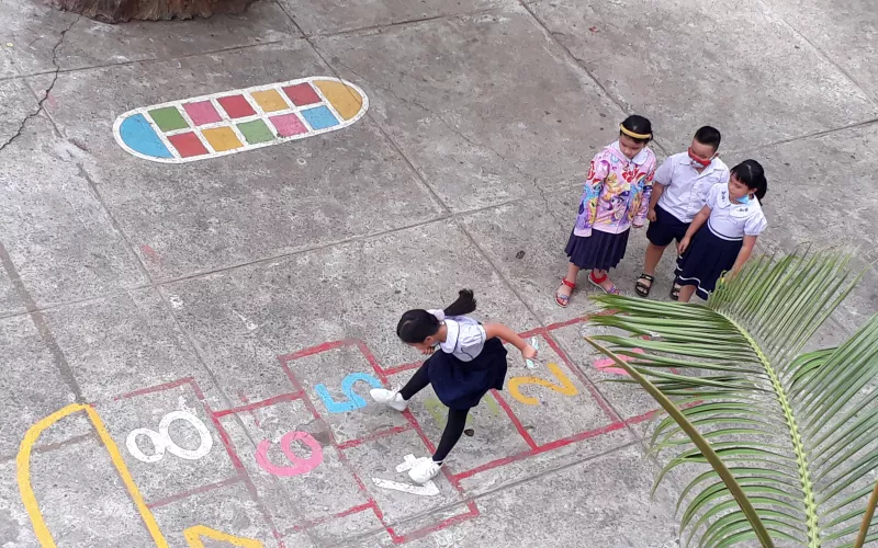 Chlidren playing hopscotch