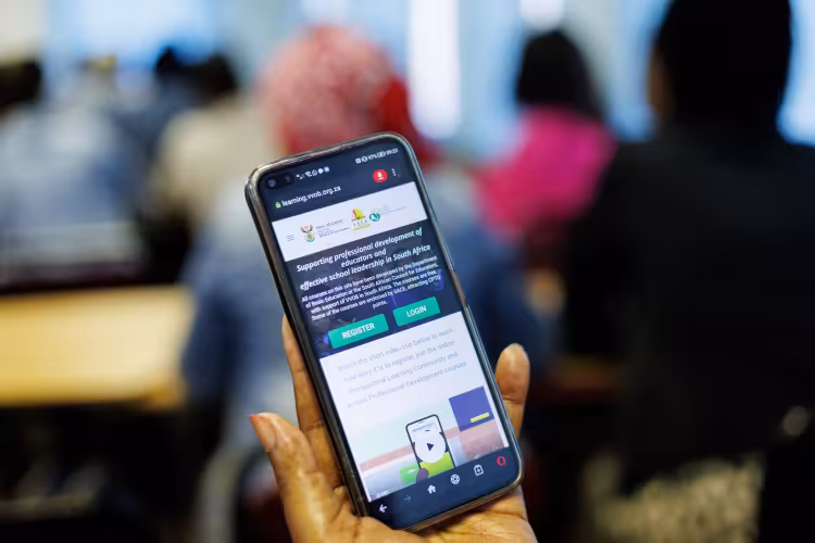 A hand holding a phone.
