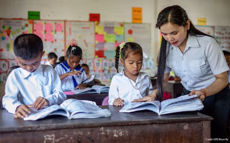 A teacher and students in a Cambodian classroom