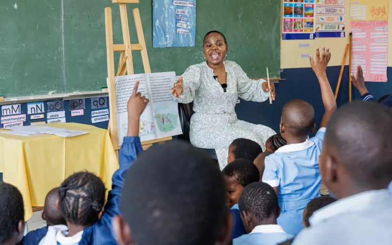 Female teacher lively interacting with her learners.