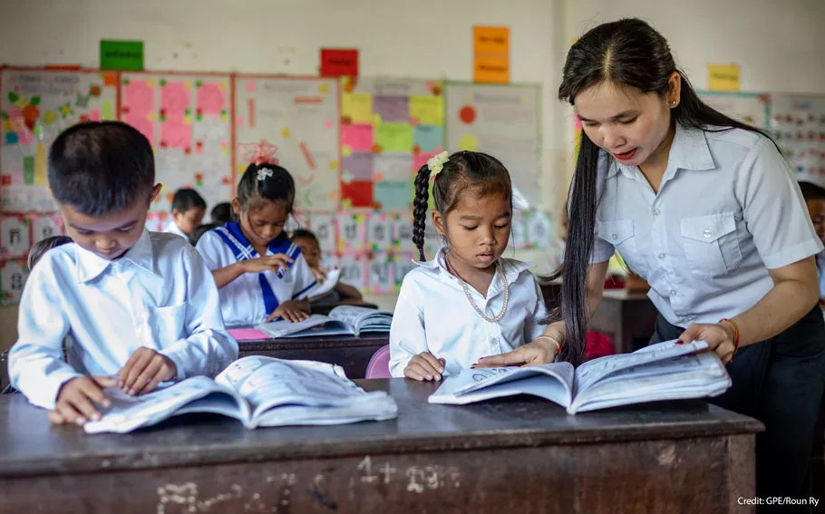 A teacher and students in a Cambodian classroom
