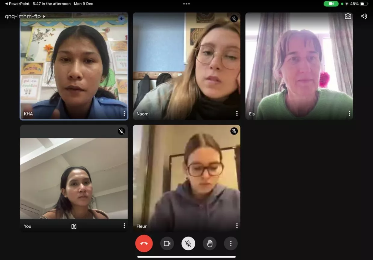 A five-person video call showing diverse participants in individual frames. Their expressions range from thoughtful to neutral, conveying focus and engagement.