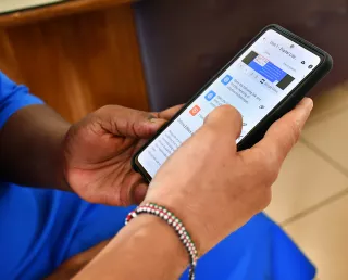 A person uses a smartphone with 