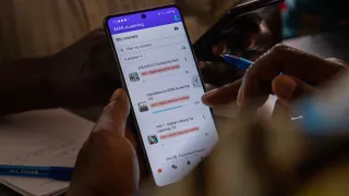 Close up of a phone with instructions on it. 