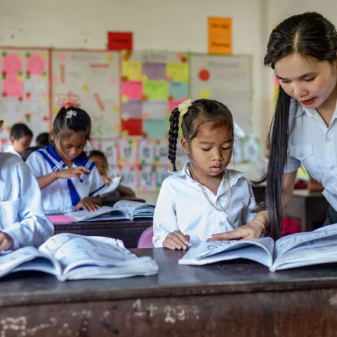 A teacher and students in a Cambodian classroom