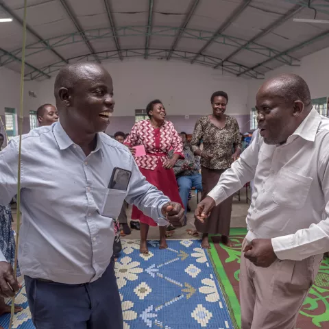 Teachers playfully interact during a training