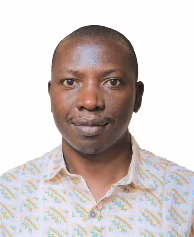 Male staff wearing a cream shirt, photographed against a plain white background.